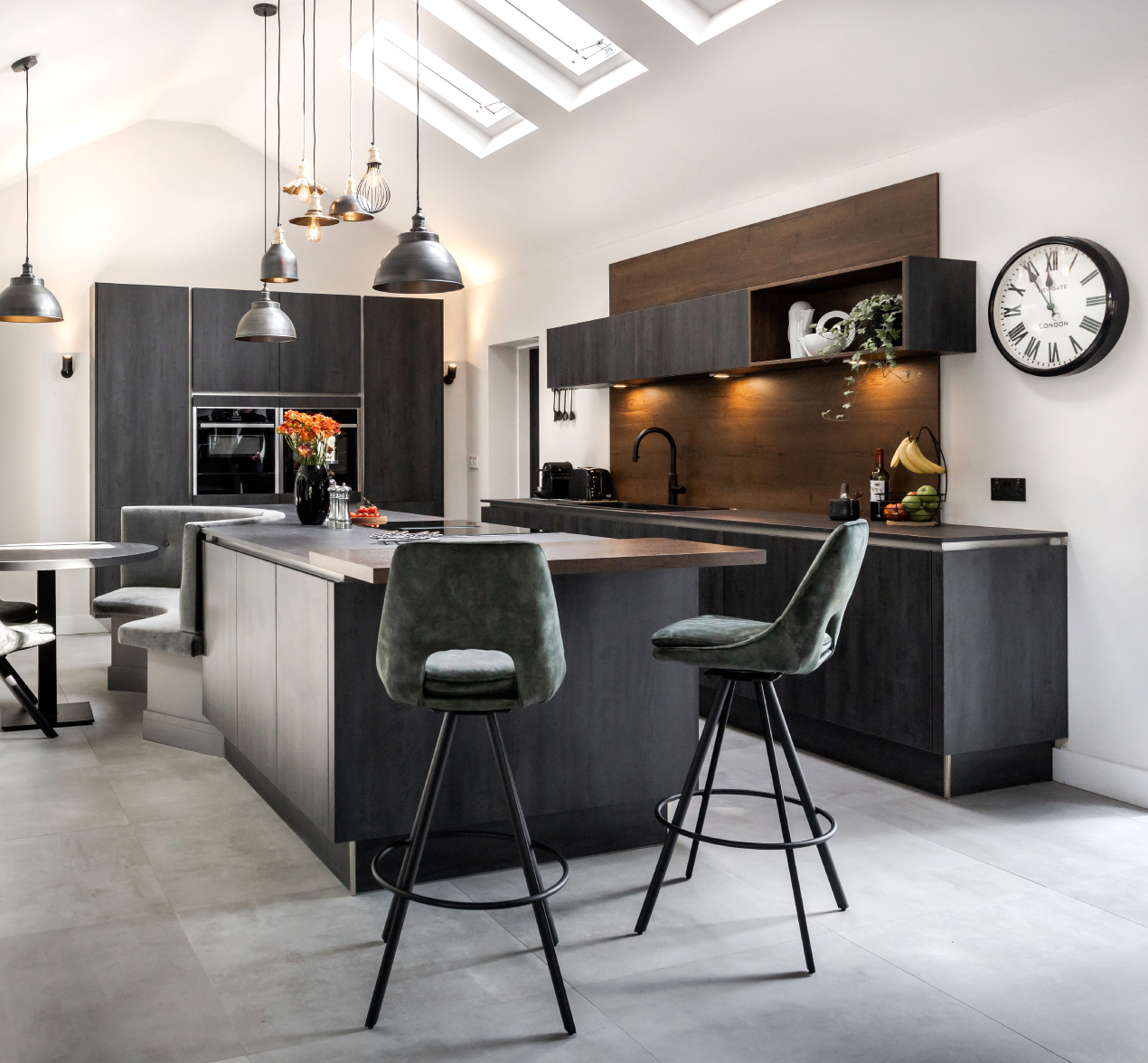 A dark industrial style kitchen with natural tones and textures