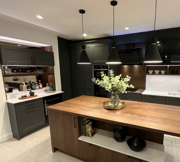 Ravenna graphite cabinetry and flat wood doors of Cognac Vintage Oak
