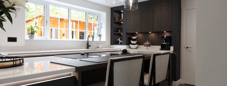 A Contemporary Graphite Kitchen with hints of Walnut